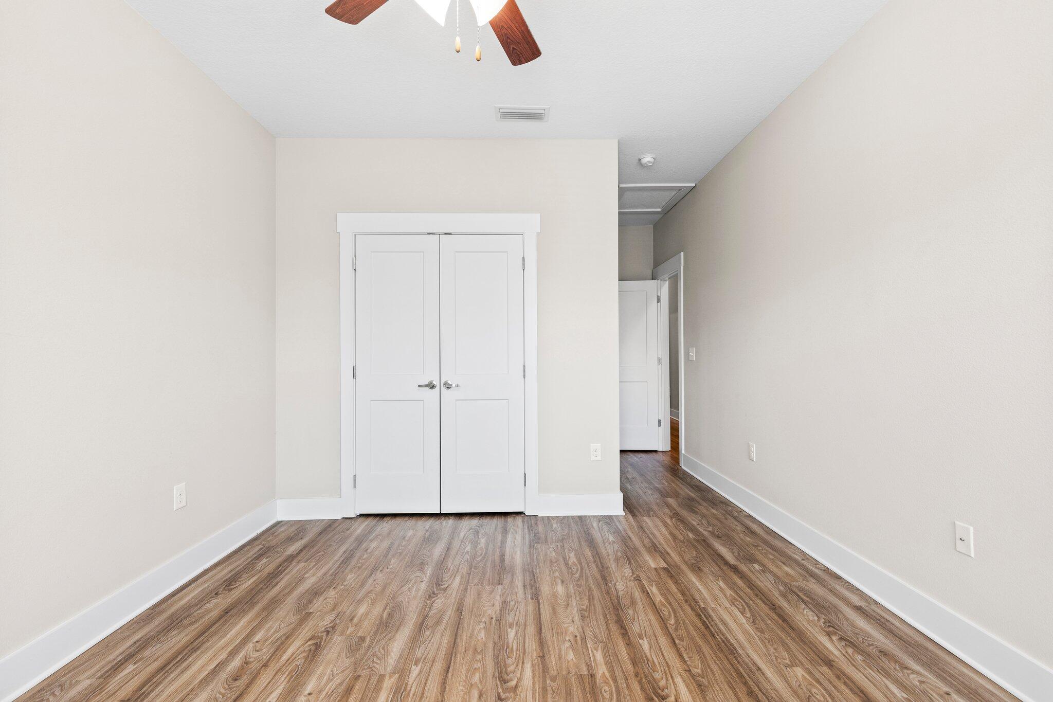 246 North Sand Palm Road Freeport, FL 32439 - Photo 20 of 36 a view of an empty room with wooden floor
