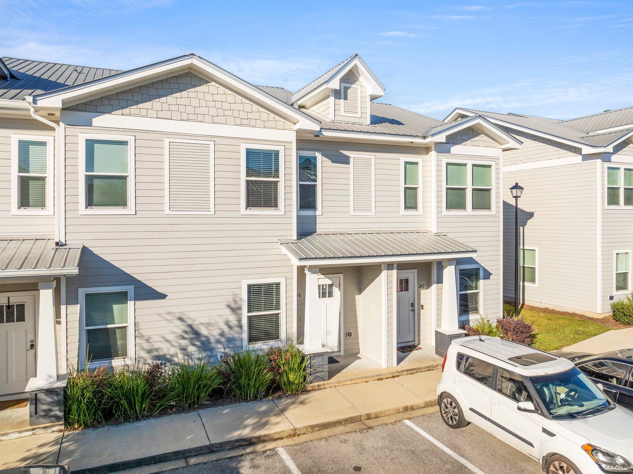 246 North Sand Palm Road Freeport, FL 32439 - Photo 2 of 36 a view of a yard in front of house