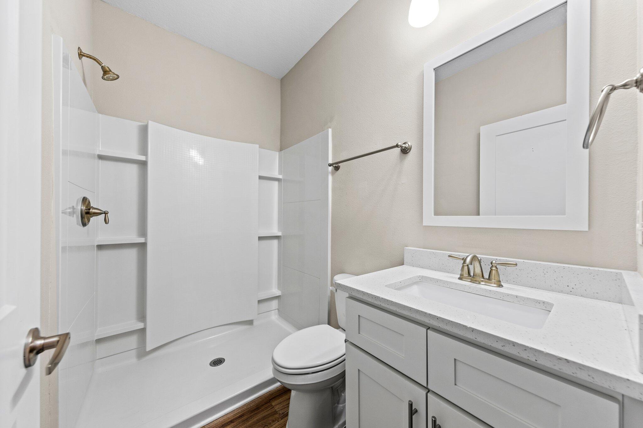 246 North Sand Palm Road Freeport, FL 32439 - Photo 21 of 36 a bathroom with a sink toilet and shower