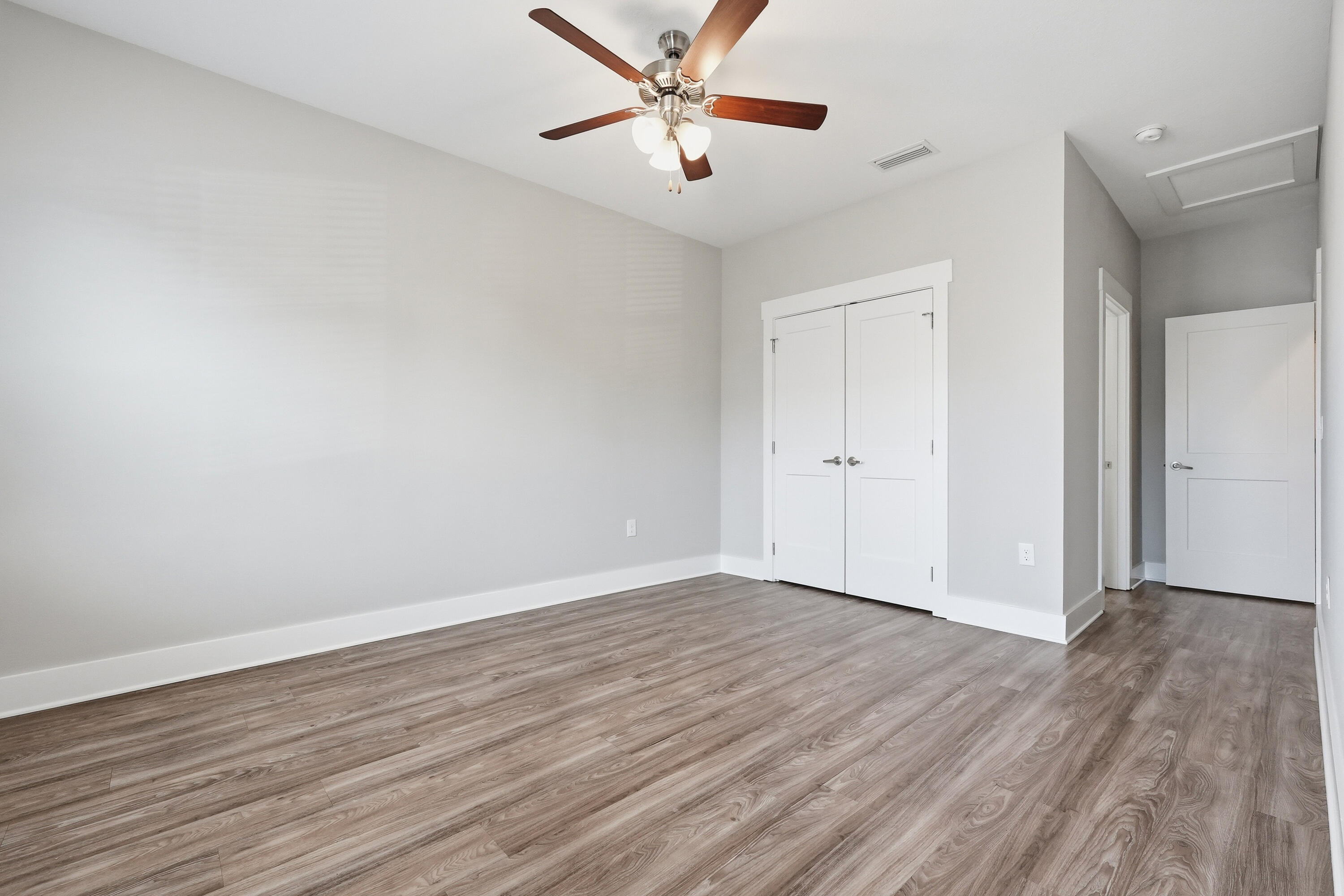 246 North Sand Palm Road Freeport, FL 32439 - Photo 23 of 42 a view of an empty room with wooden floor