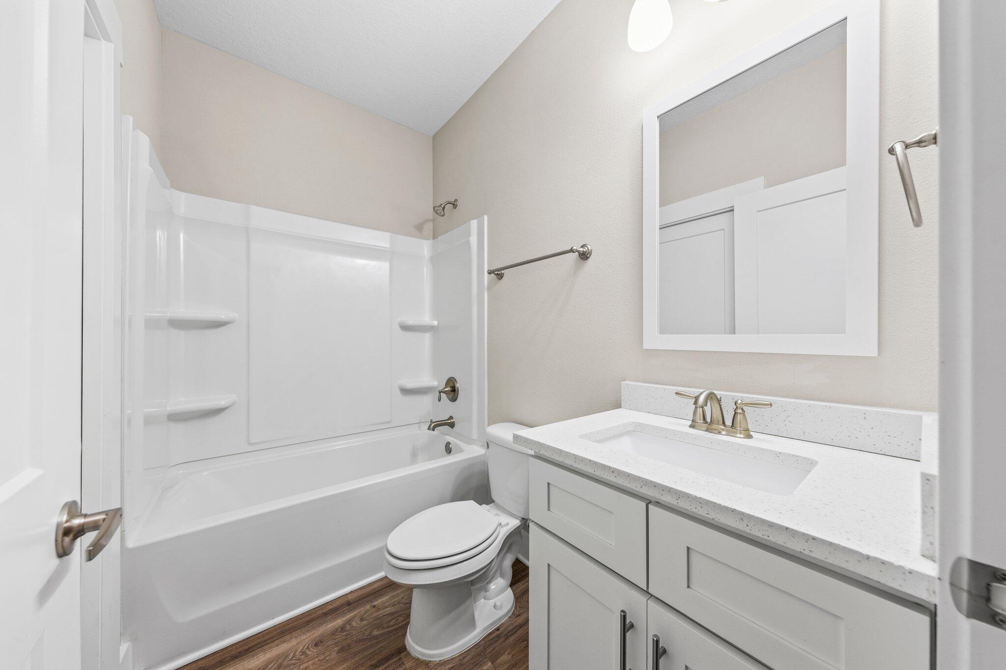 246 North Sand Palm Road Freeport, FL 32439 - Photo 27 of 36 a bathroom with a sink a toilet and shower