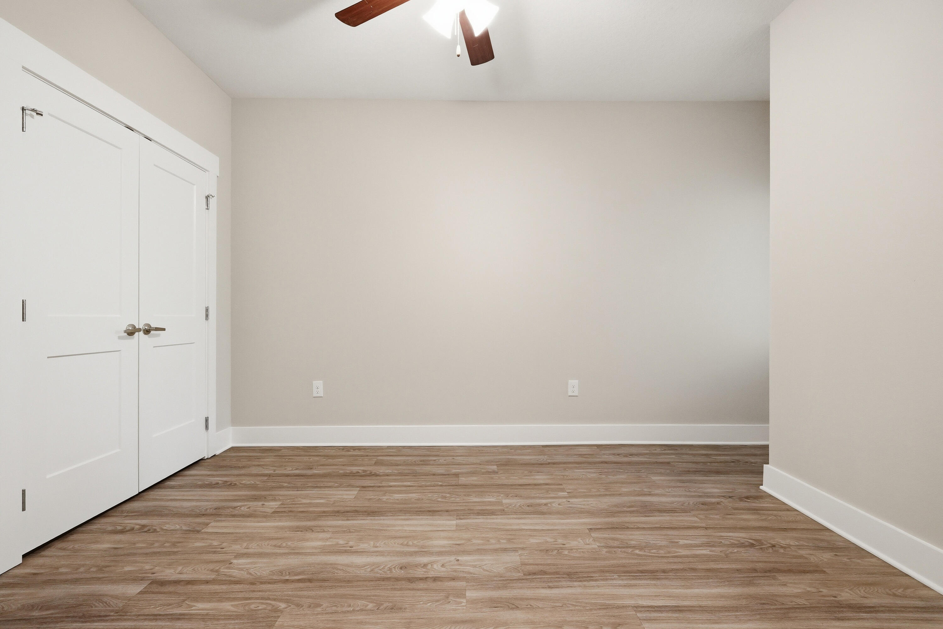 246 North Sand Palm Road Freeport, FL 32439 - Photo 27 of 42 a view of an empty room with wooden floor