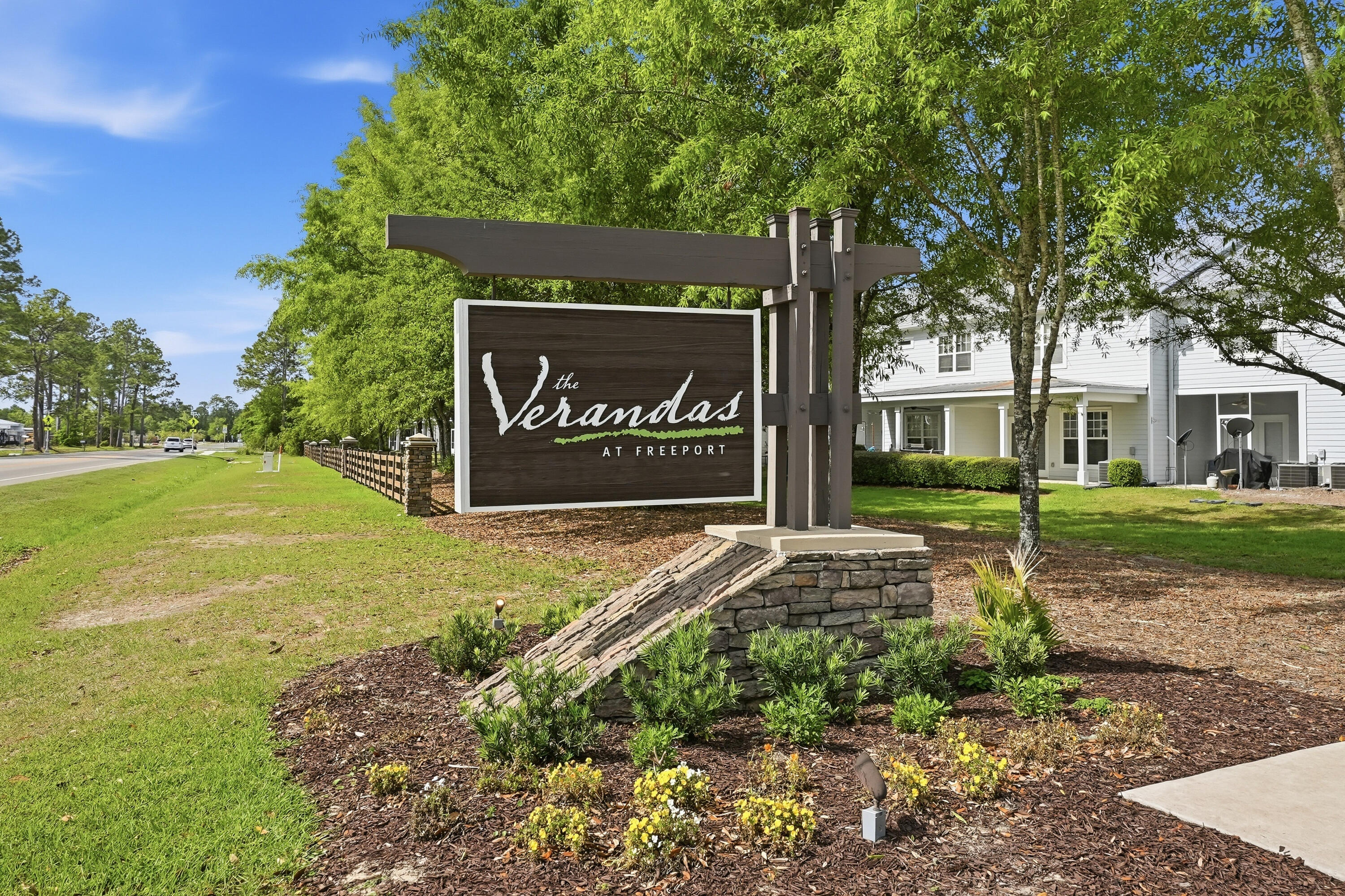 246 North Sand Palm Road Freeport, FL 32439 - Photo 31 of 42 a sign board with a house in the background