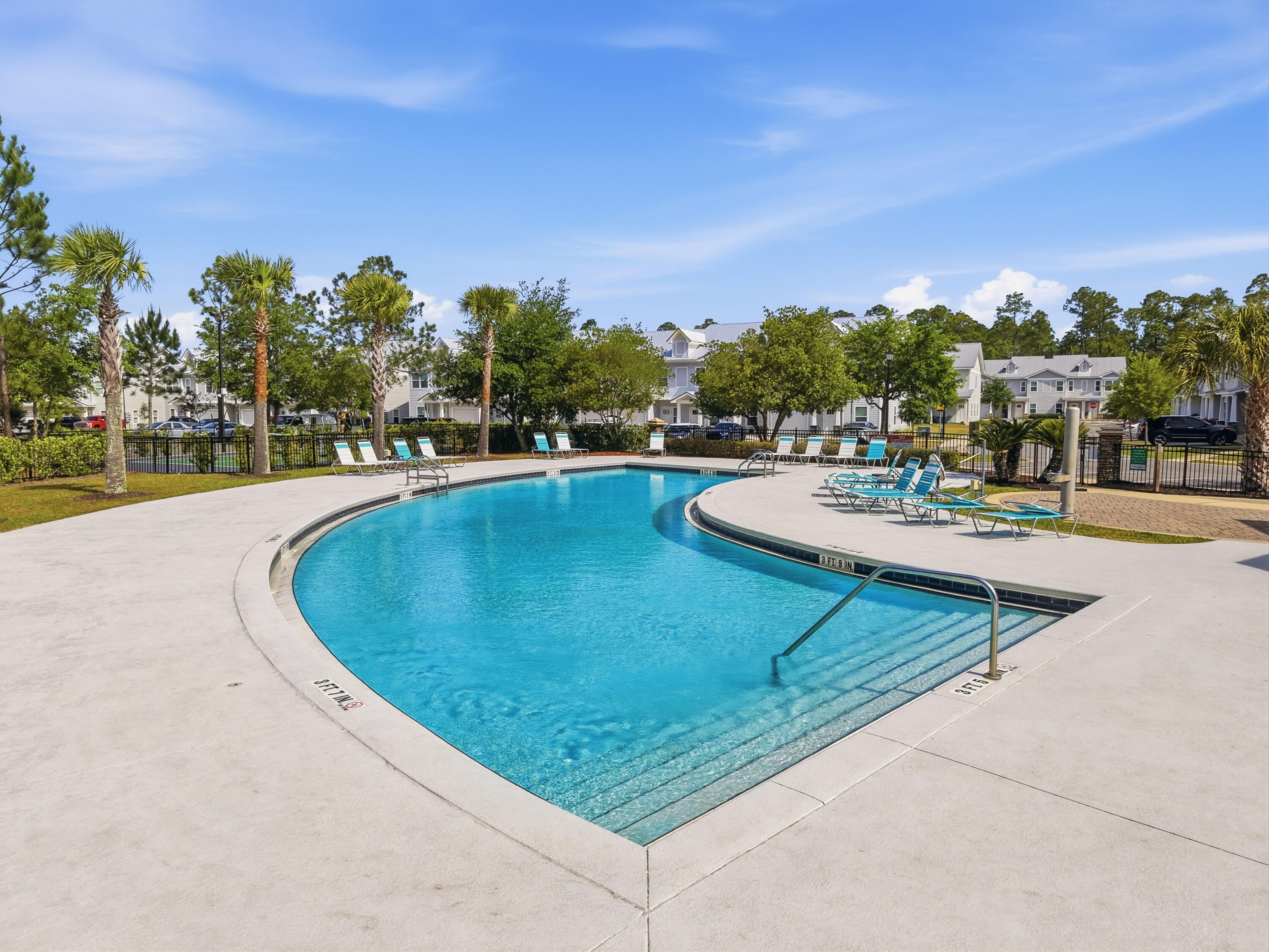 246 North Sand Palm Road Freeport, FL 32439 - Photo 35 of 42 a view of a swimming pool with outdoor seating and plants