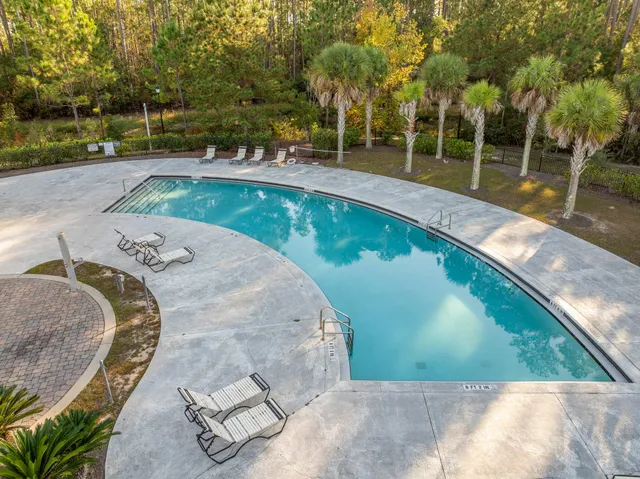 a view of a swimming pool with a patio