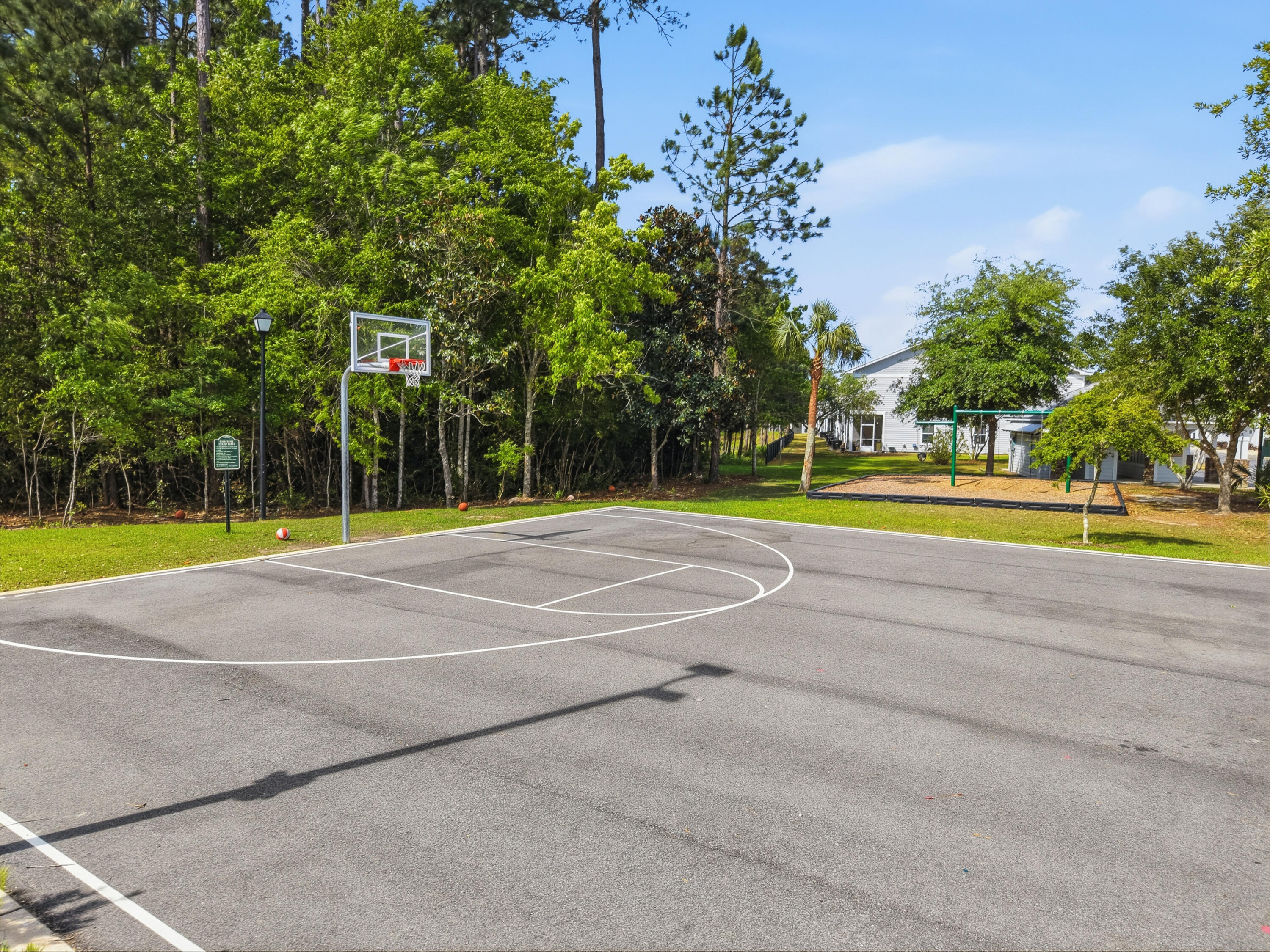 246 North Sand Palm Road Freeport, FL 32439 - Photo 38 of 42 a view of a tennis ground with large trees