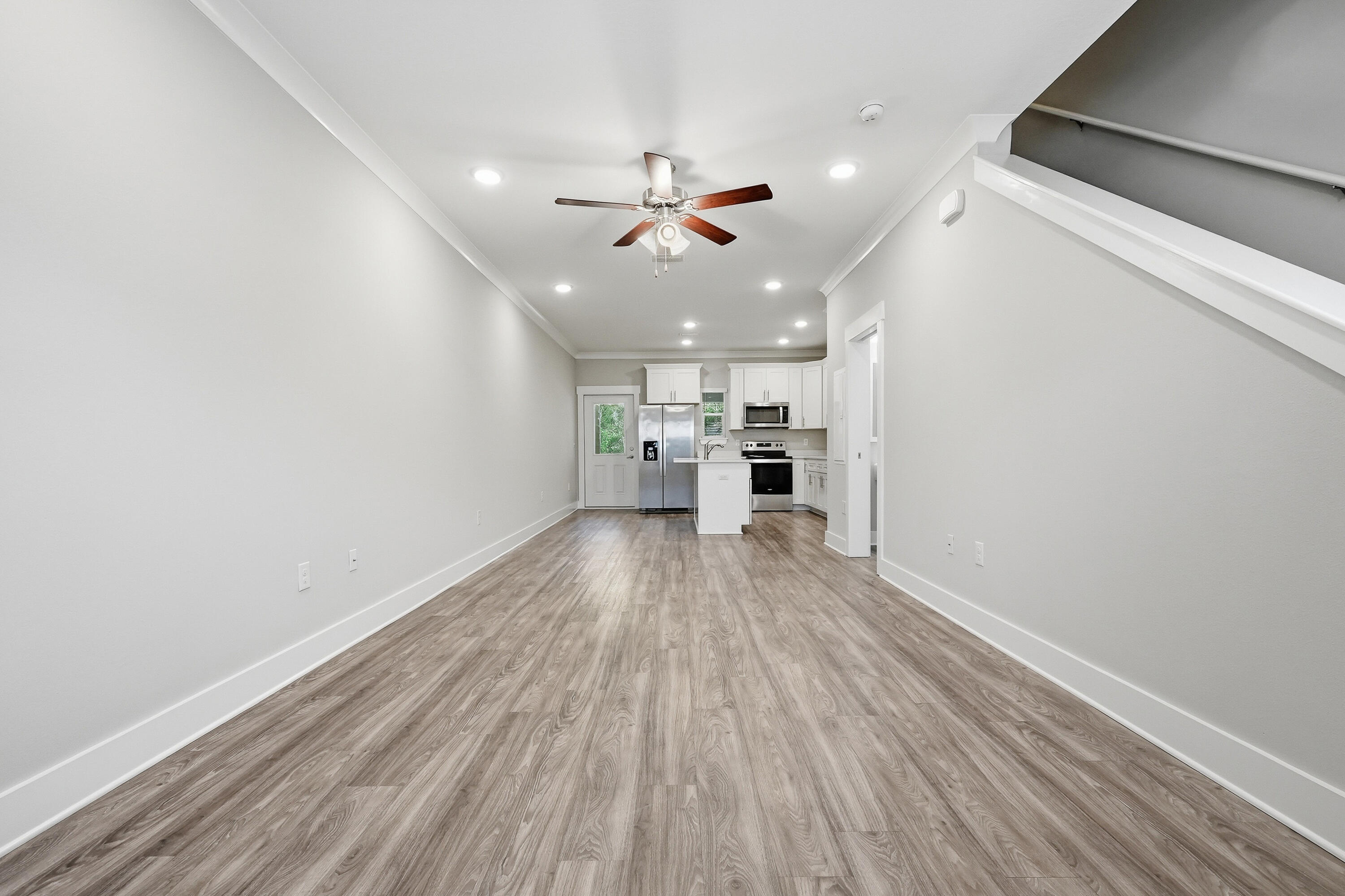 246 North Sand Palm Road Freeport, FL 32439 - Photo 7 of 42 wooden floor in an empty room with a window