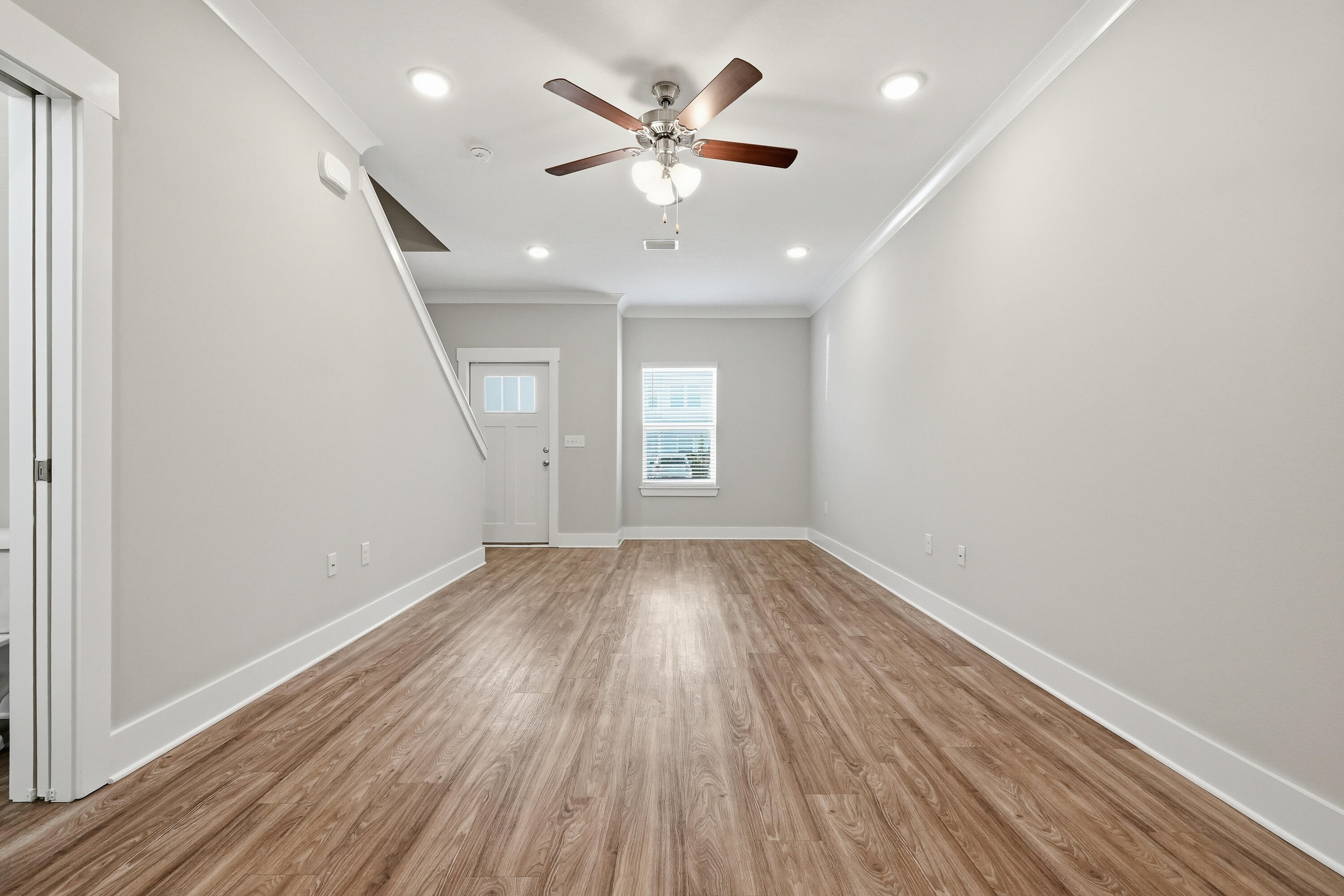 246 North Sand Palm Road Freeport, FL 32439 - Photo 8 of 42 wooden floor in an empty room with a window