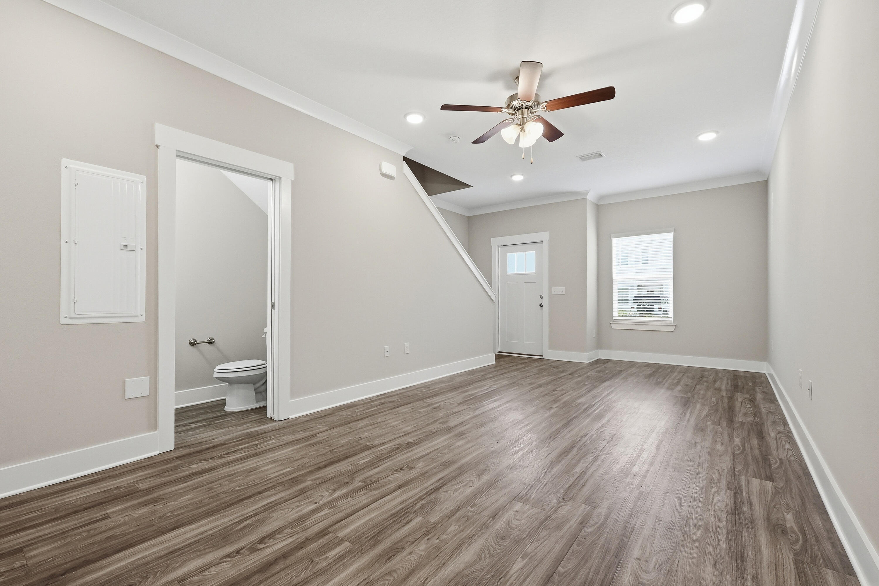 246 North Sand Palm Road Freeport, FL 32439 - Photo 9 of 42 wooden floor in an empty room with a window