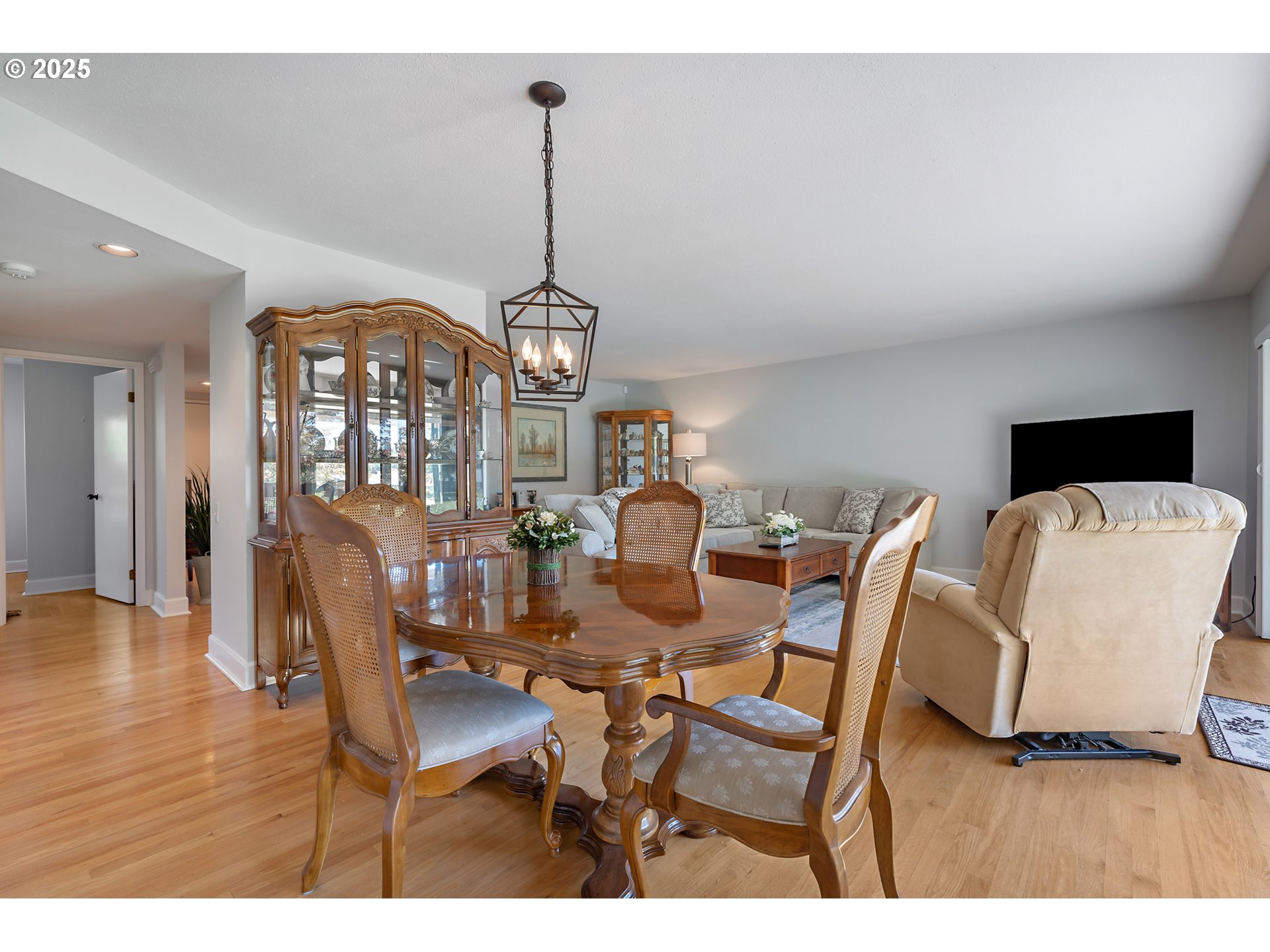 15730 Southwest Greens Way Portland, OR 97224 - Photo 11 of 42 a view of a dining room with furniture and chandelier