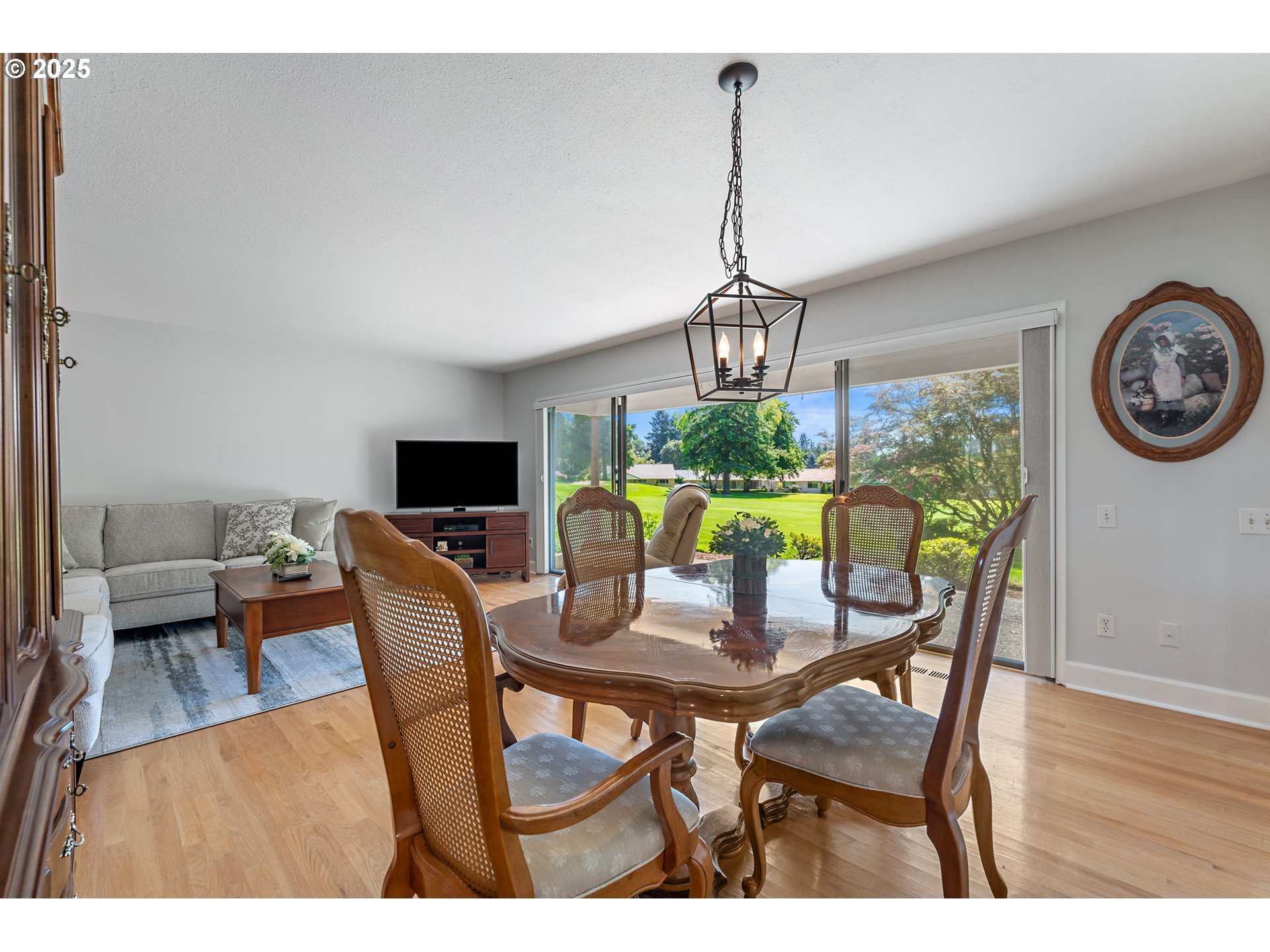 15730 Southwest Greens Way Portland, OR 97224 - Photo 12 of 42 a view of a dining room with furniture window and wooden floor