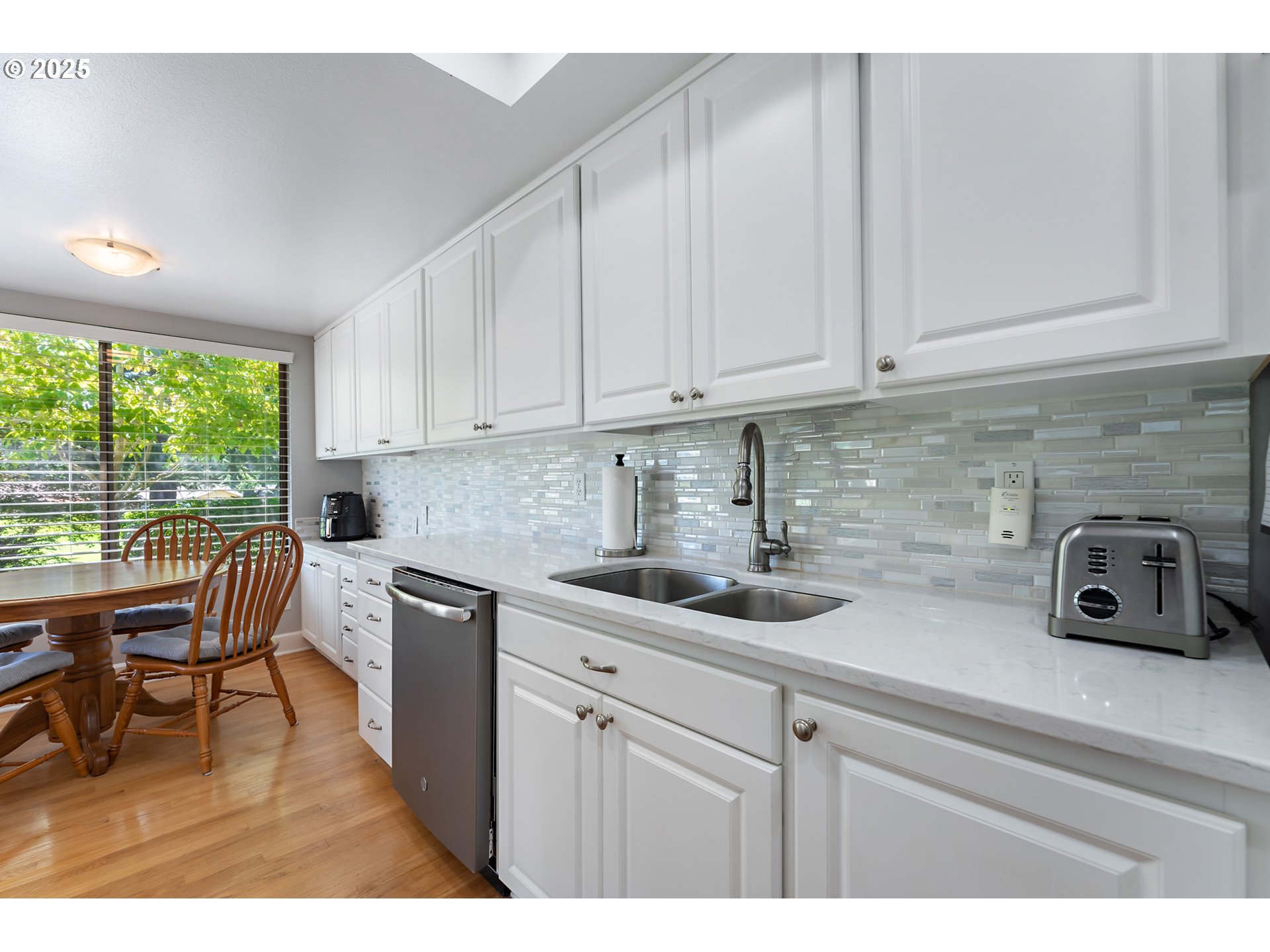 15730 Southwest Greens Way Portland, OR 97224 - Photo 15 of 42 a kitchen with a sink and cabinets
