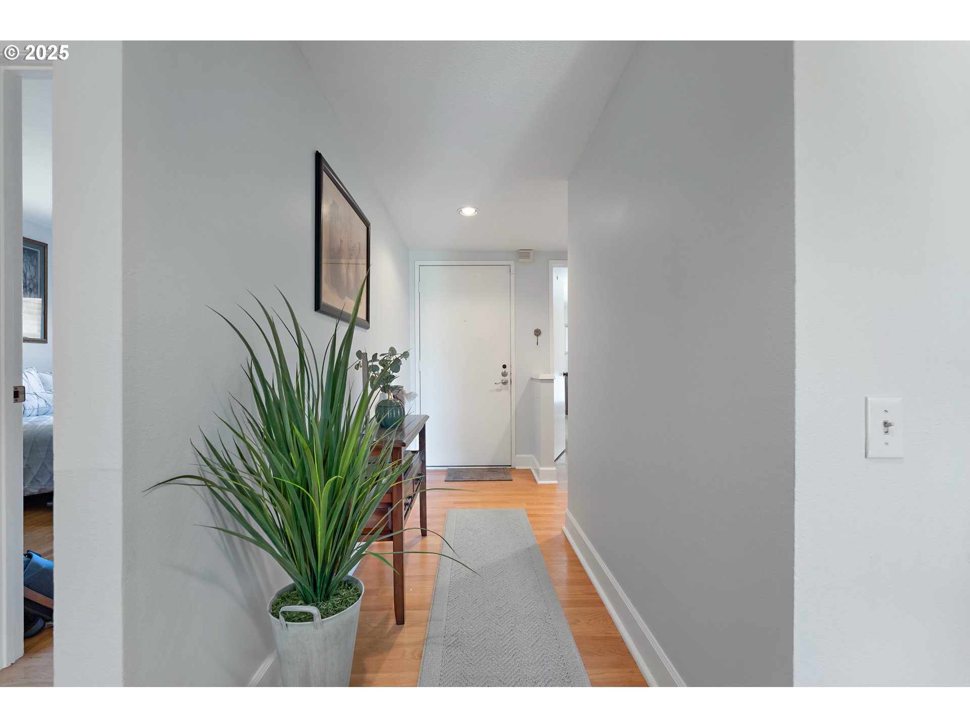 15730 Southwest Greens Way Portland, OR 97224 - Photo 21 of 42 a hallway with plants and mirror