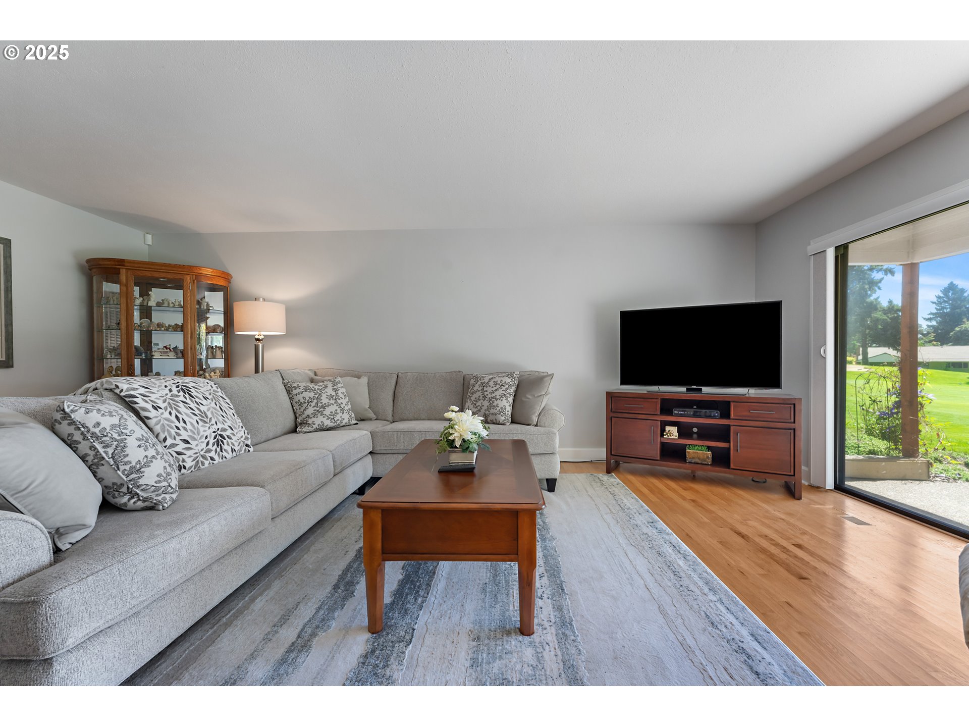 15730 Southwest Greens Way Portland, OR 97224 - Photo 5 of 42 a living room with furniture and a flat screen tv