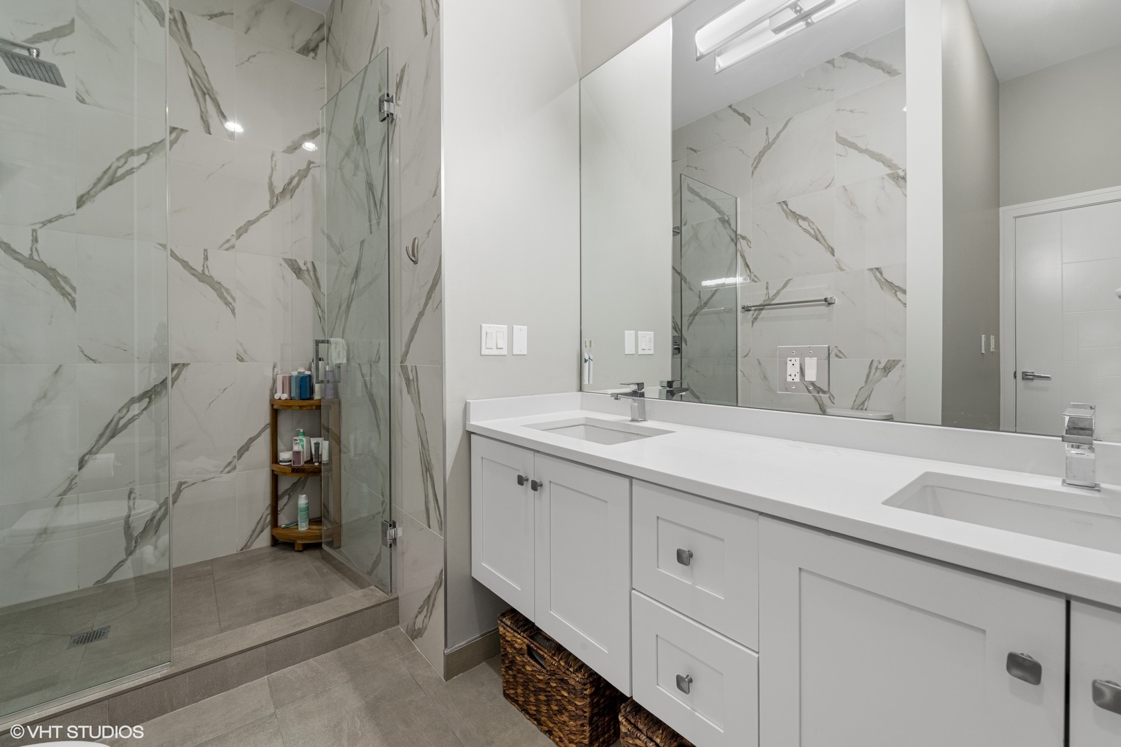 1532 North Artesian Avenue, Unit 3 Chicago, IL 60622 - Photo 12 of 25 a bathroom with a double vanity sink and a mirror