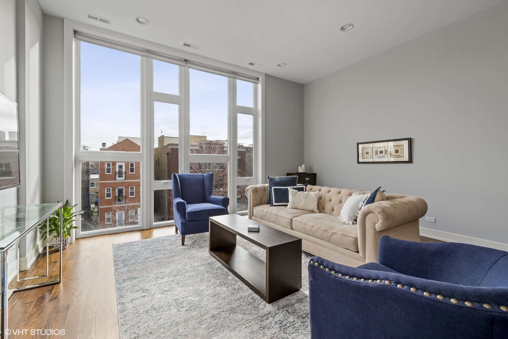 1532 North Artesian Avenue, Unit 3 Chicago, IL 60622 - Photo 3 of 25 a living room with furniture and a large window
