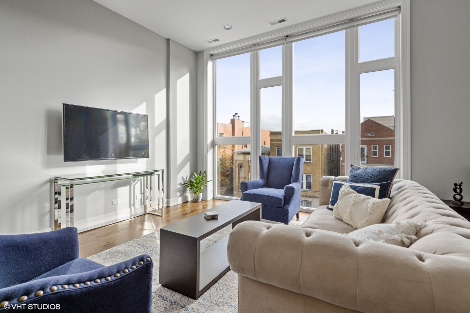 1532 North Artesian Avenue, Unit 3 Chicago, IL 60622 - Photo 4 of 25 a living room with furniture and a flat screen tv