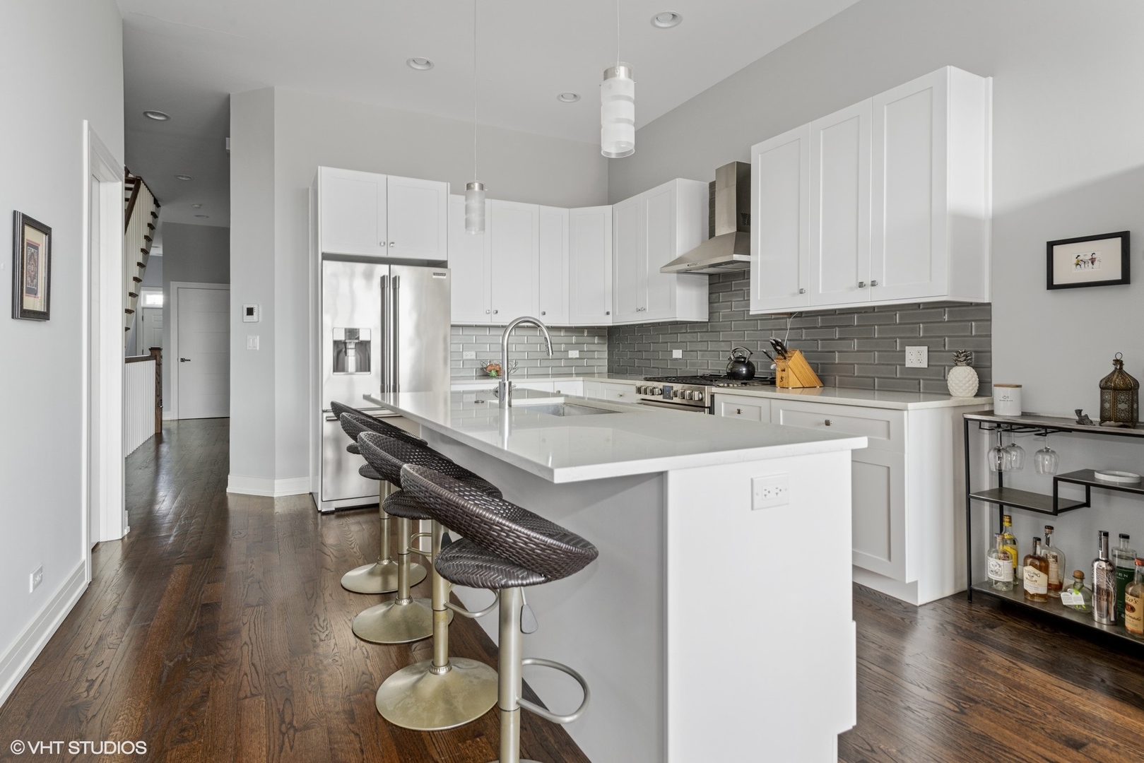 1532 North Artesian Avenue, Unit 3 Chicago, IL 60622 - Photo 6 of 25 a kitchen with stainless steel appliances granite countertop a sink a stove and a refrigerator