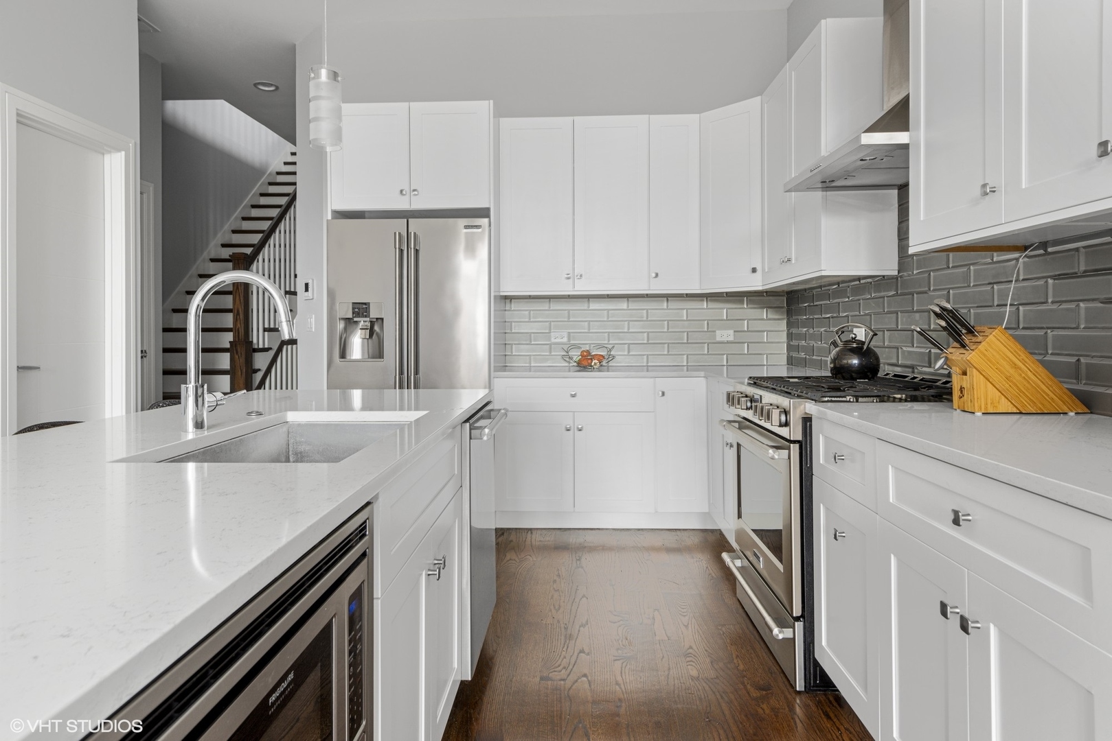 1532 North Artesian Avenue, Unit 3 Chicago, IL 60622 - Photo 8 of 25 a kitchen with stainless steel appliances granite countertop a sink and cabinets