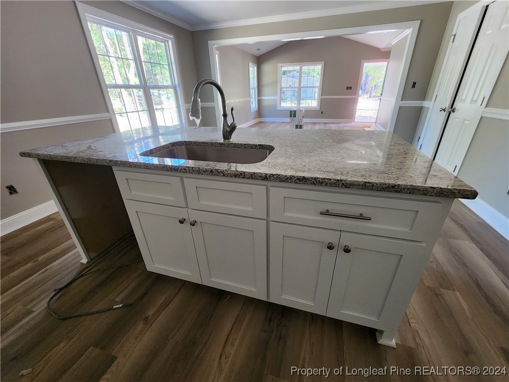 910 West Street Smithfield, NC 27577 - Photo 22 of 47 a close view of a sink a mirror and cabinets