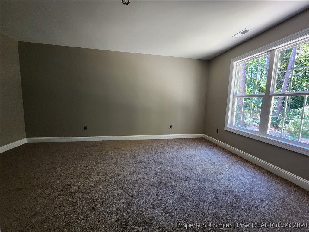 910 West Street Smithfield, NC 27577 - Photo 35 of 47 an empty room with a window