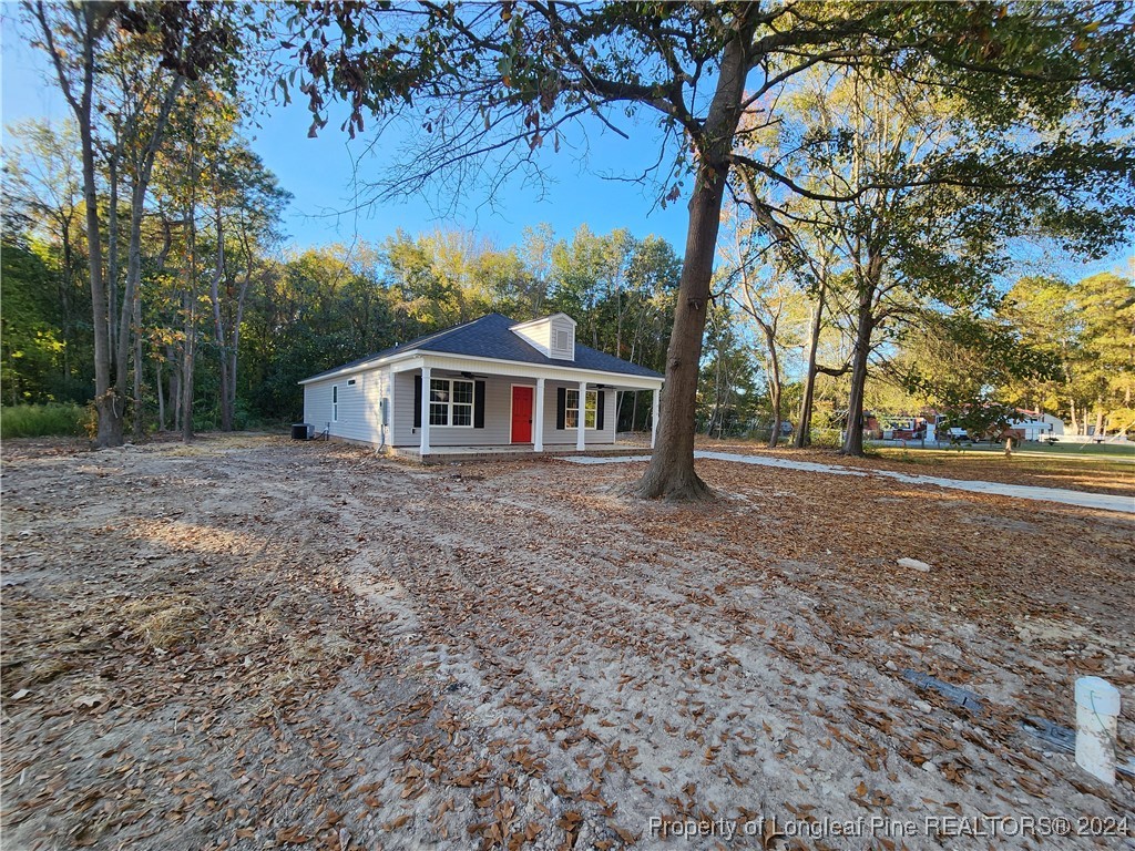 910 West Street Smithfield, NC 27577 - Photo 44 of 47 a house with trees in front of it