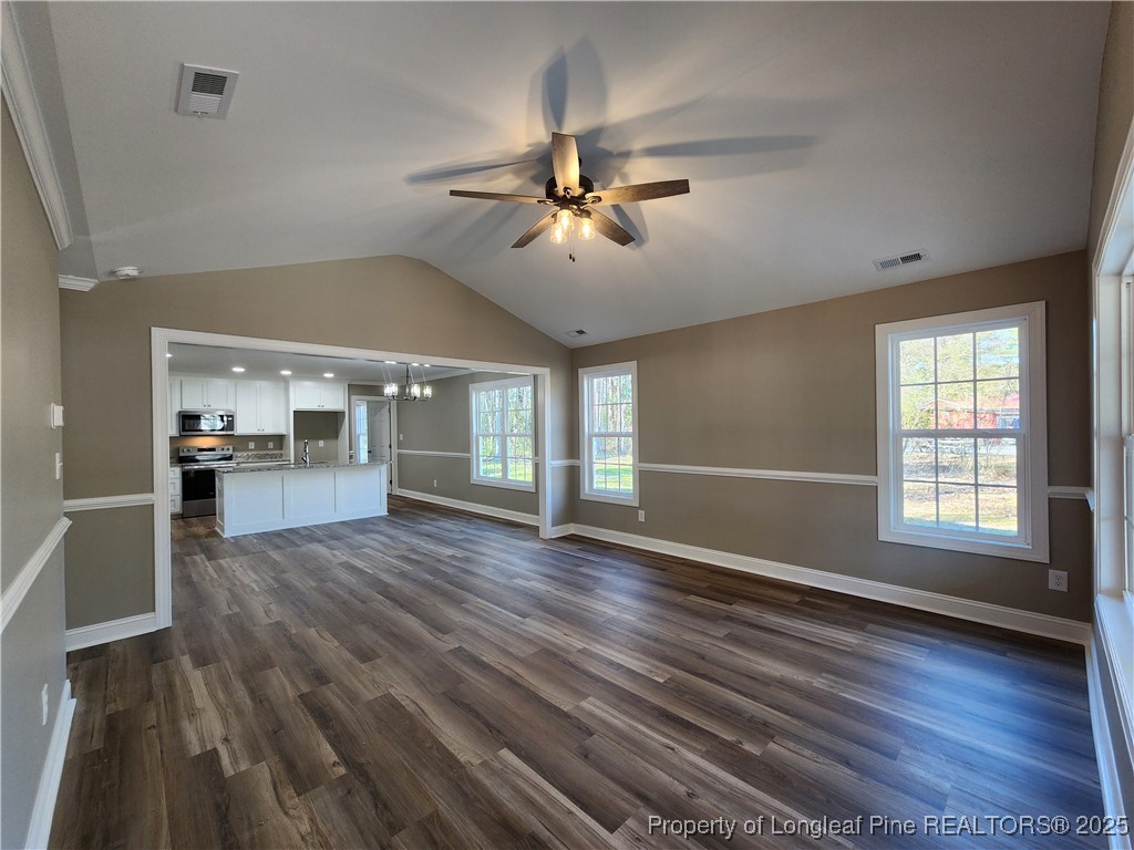 910 West Street Smithfield, NC 27577 - Photo 7 of 47 a view of empty room with wooden floor and fan