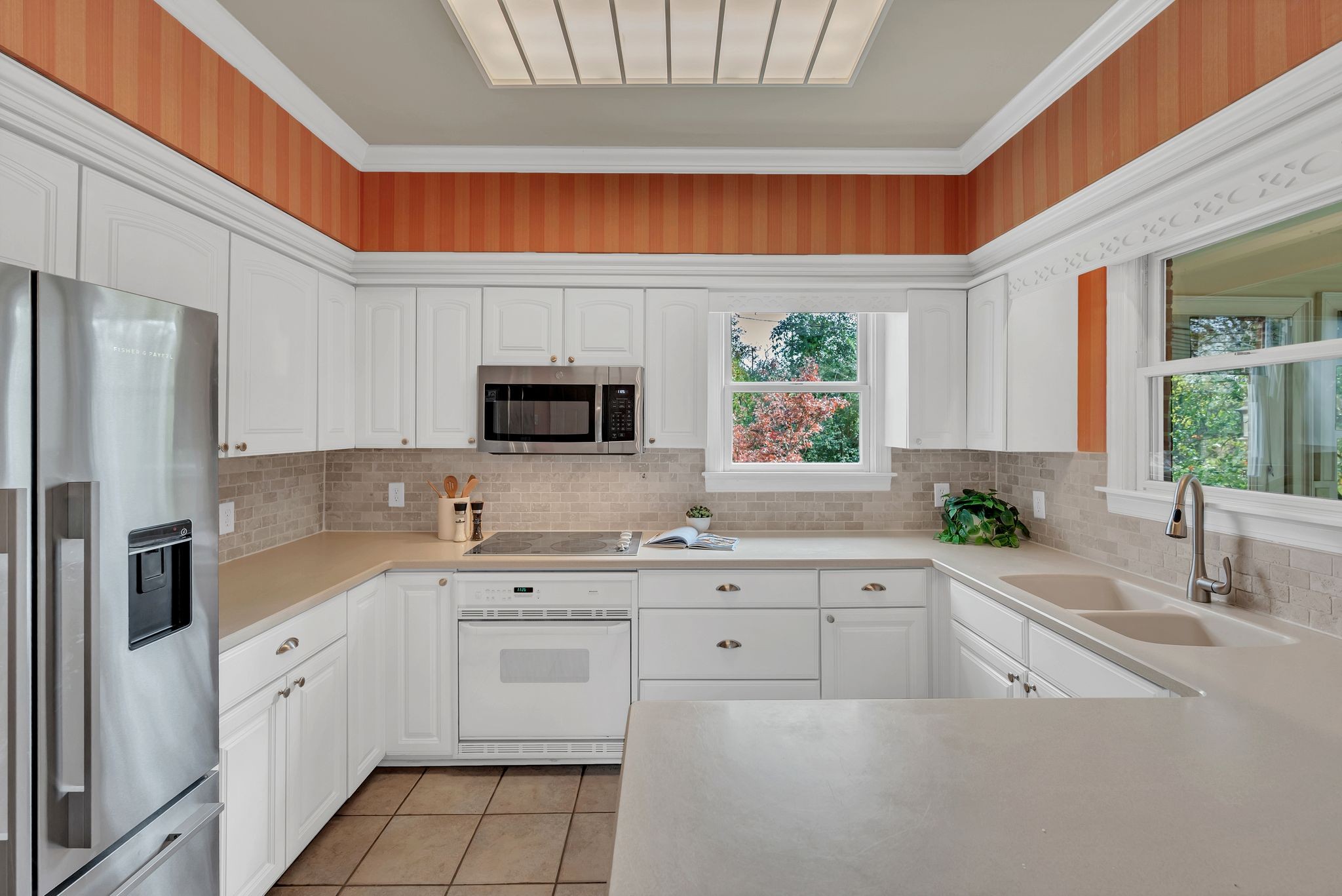 620 Estes Road Nashville, TN 37215 - Photo 16 of 40 a kitchen with stainless steel appliances a sink cabinets and a window