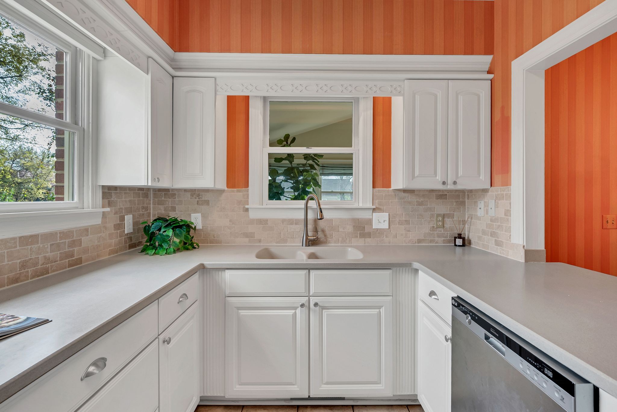 620 Estes Road Nashville, TN 37215 - Photo 17 of 40 a kitchen with white cabinets and a window