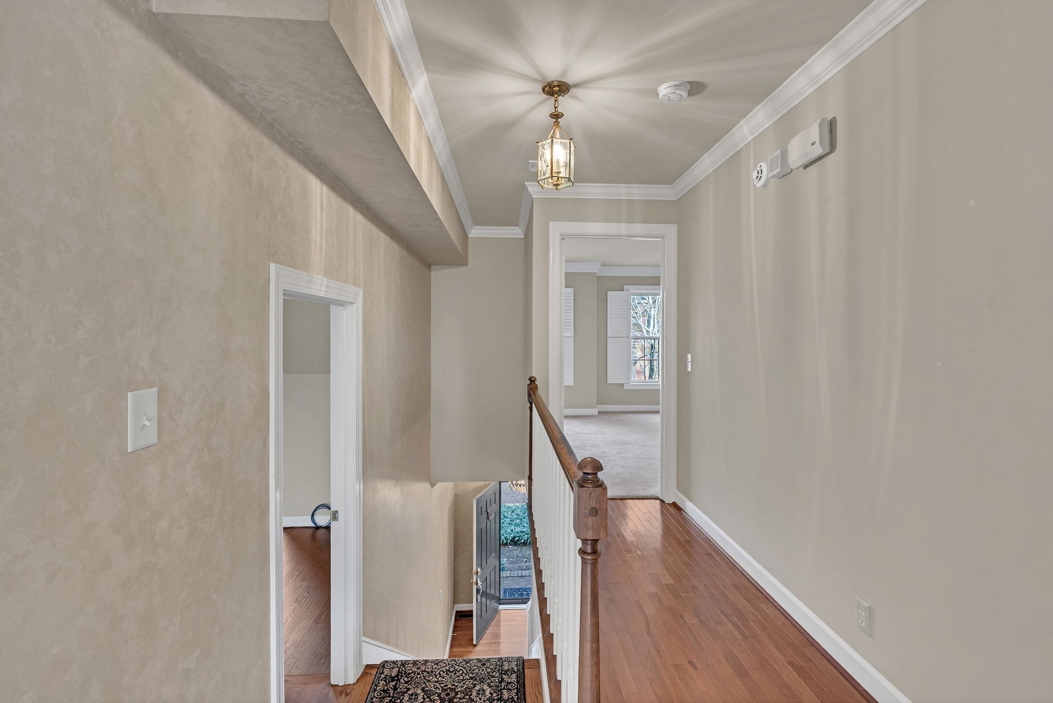 620 Estes Road Nashville, TN 37215 - Photo 24 of 40 a view of a hallway with wooden floor and staircase