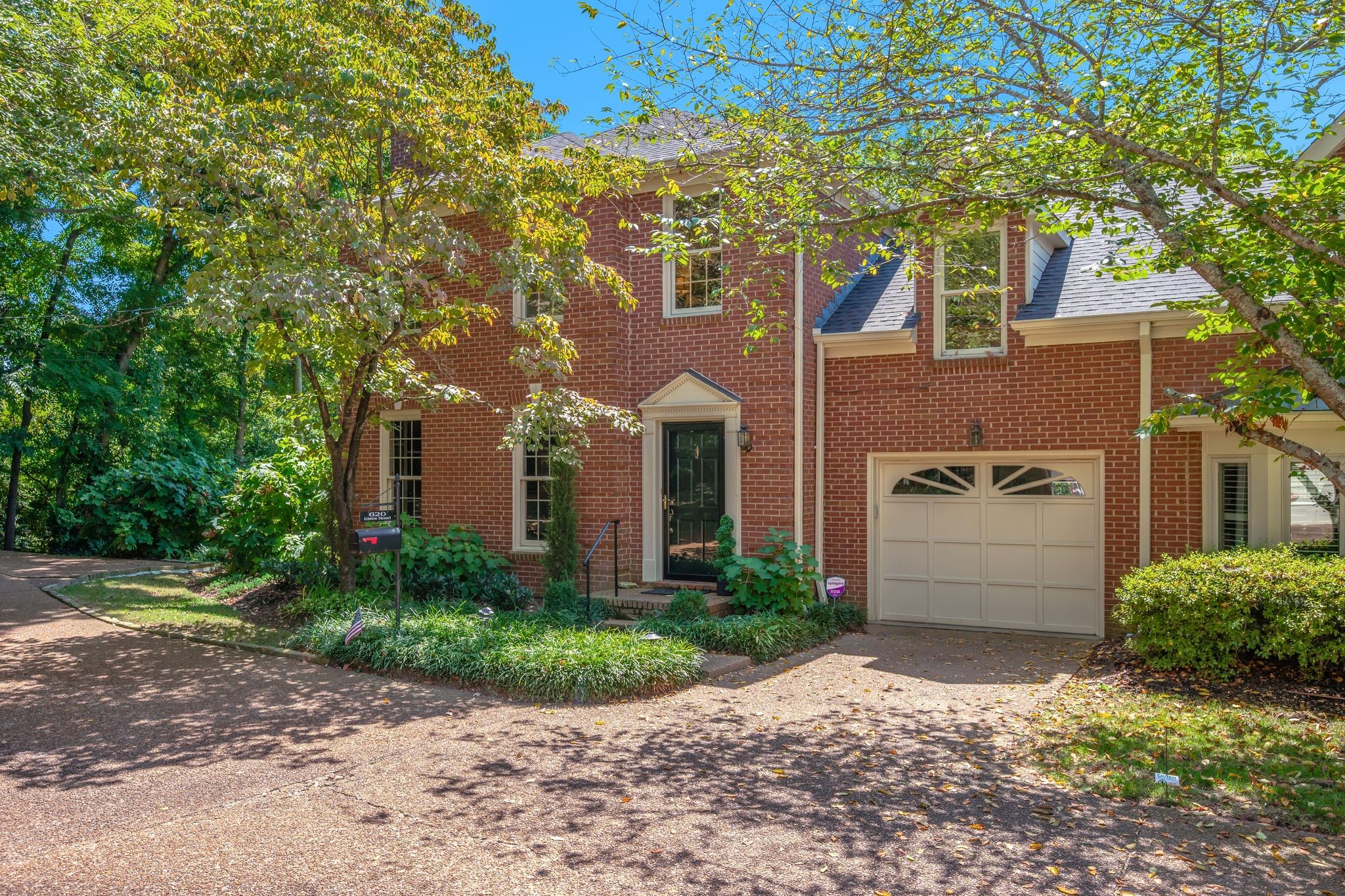 620 Estes Road Nashville, TN 37215 - Photo 3 of 40 a front view of a house with a yard and garage