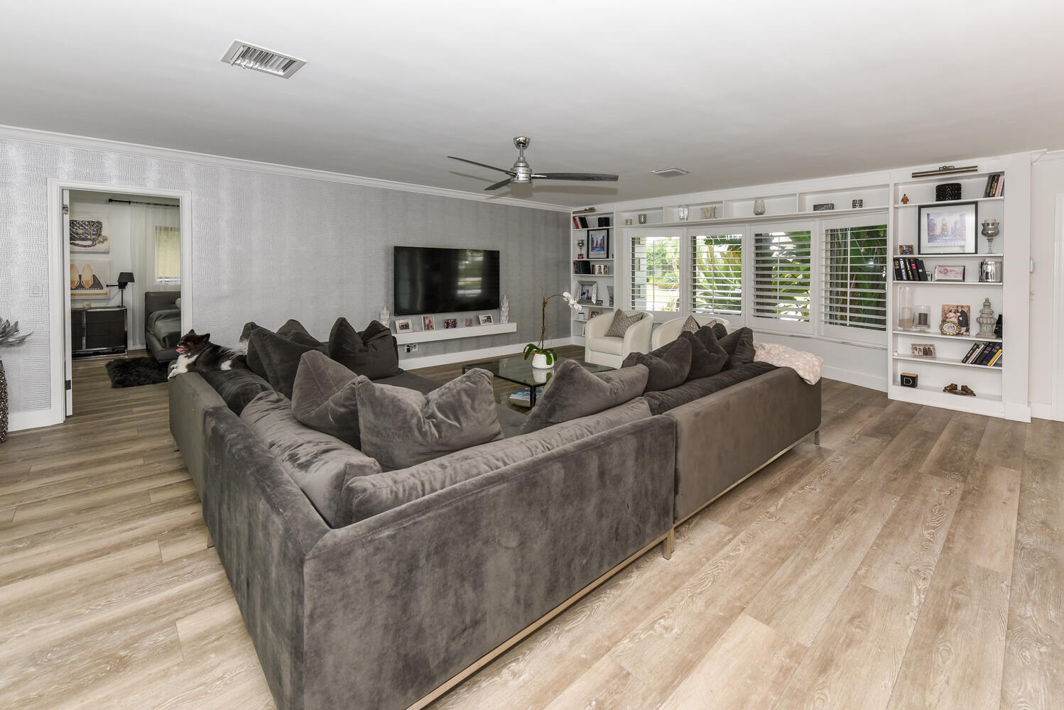 880 Hickory Terrace Boca Raton, FL 33486 - Photo 15 of 38 a living room with furniture and a flat screen tv
