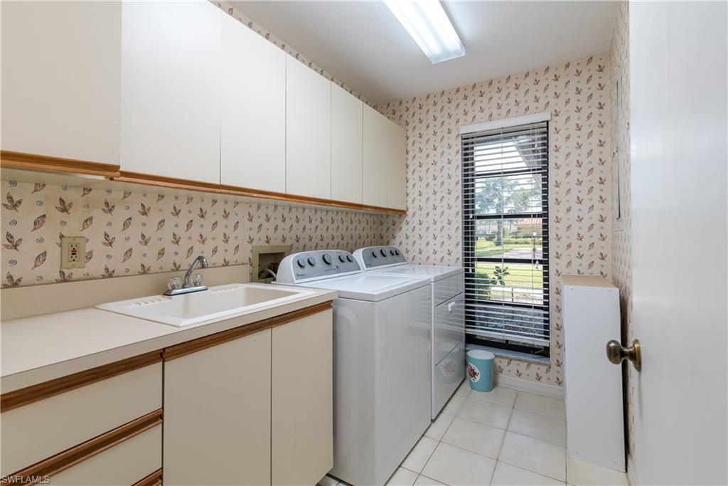 2287 Queens Way Naples, FL 34112 - Photo 21 of 21 Large laundry room with full size appliances and sink. Pretty view too!!