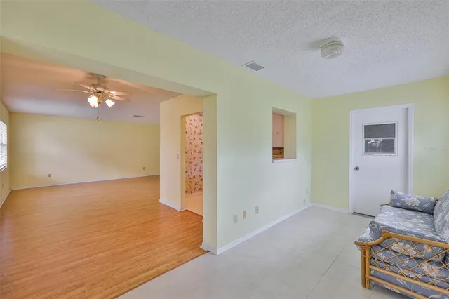 a bathroom with a granite countertop sink a toilet and a bathtub
