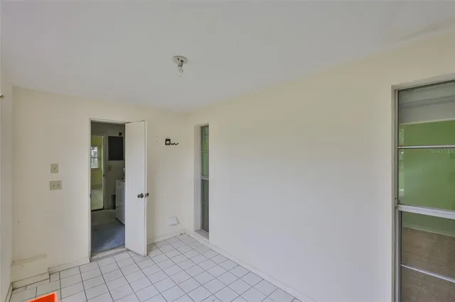 an aerial view of residential houses with outdoor space and swimming pool