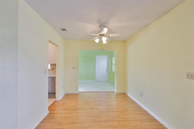 a view of an empty room with a bathroom