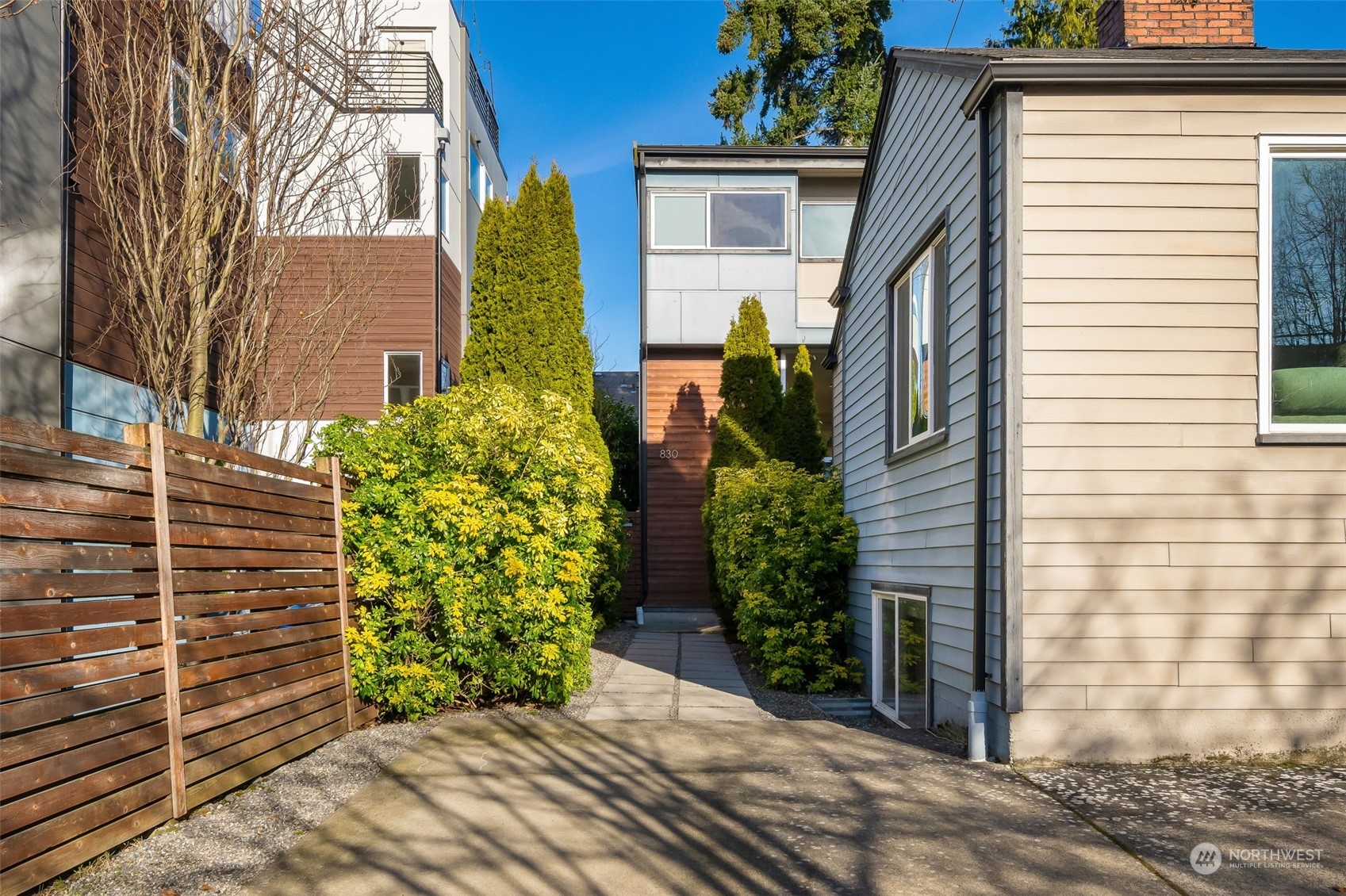 830 Northwest 53rd Street, Unit B Seattle, WA 98107 - Photo 1 of 28 a view of a house with potted plants
