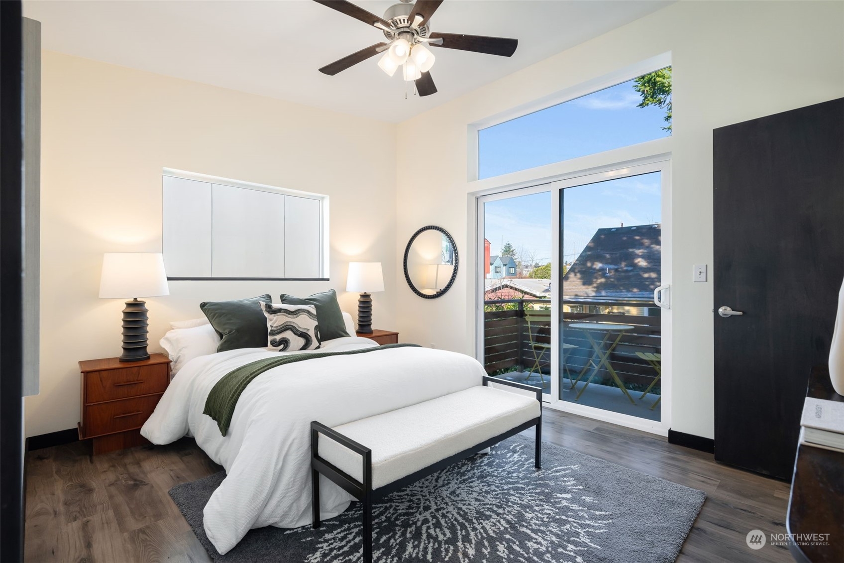 830 Northwest 53rd Street, Unit B Seattle, WA 98107 - Photo 12 of 28 a bedroom with a bed and window