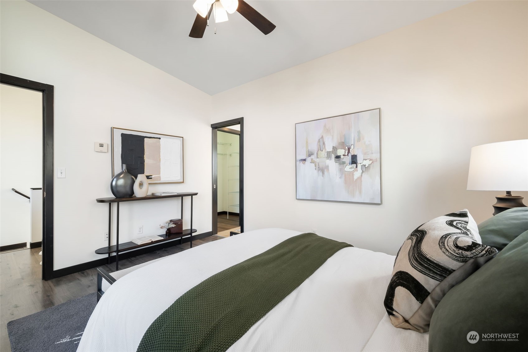 830 Northwest 53rd Street, Unit B Seattle, WA 98107 - Photo 13 of 28 a bedroom with a bed and furniture