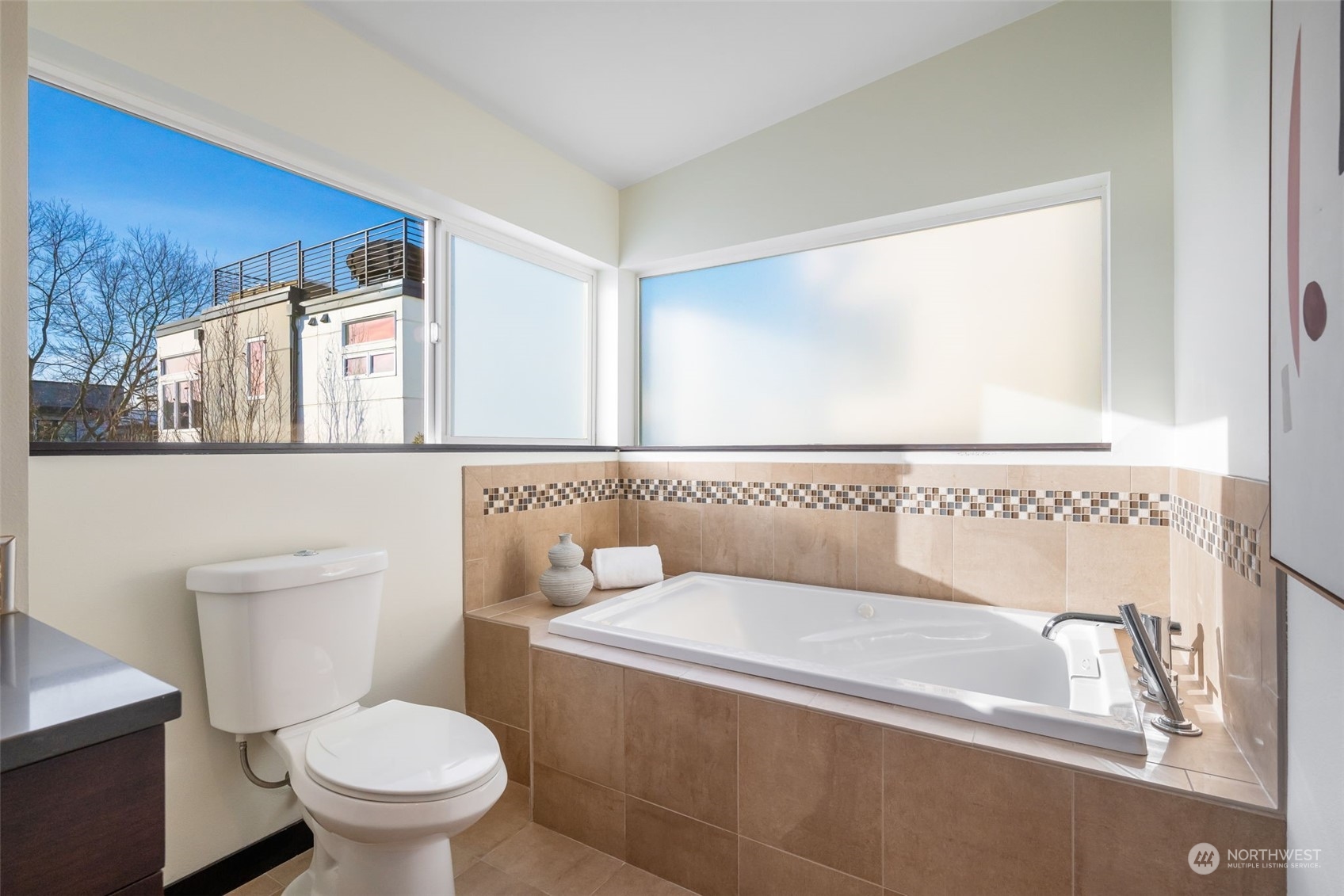 830 Northwest 53rd Street, Unit B Seattle, WA 98107 - Photo 15 of 28 a bathroom with a toilet and a sink
