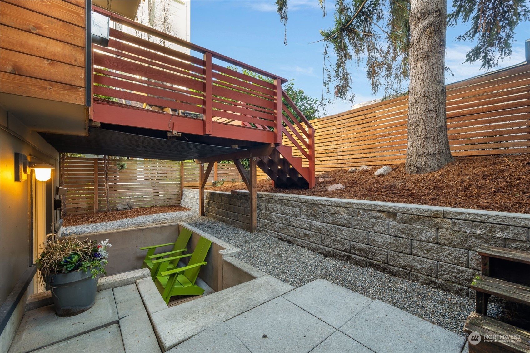 830 Northwest 53rd Street, Unit B Seattle, WA 98107 - Photo 27 of 28 a backyard of a house with outdoor seating