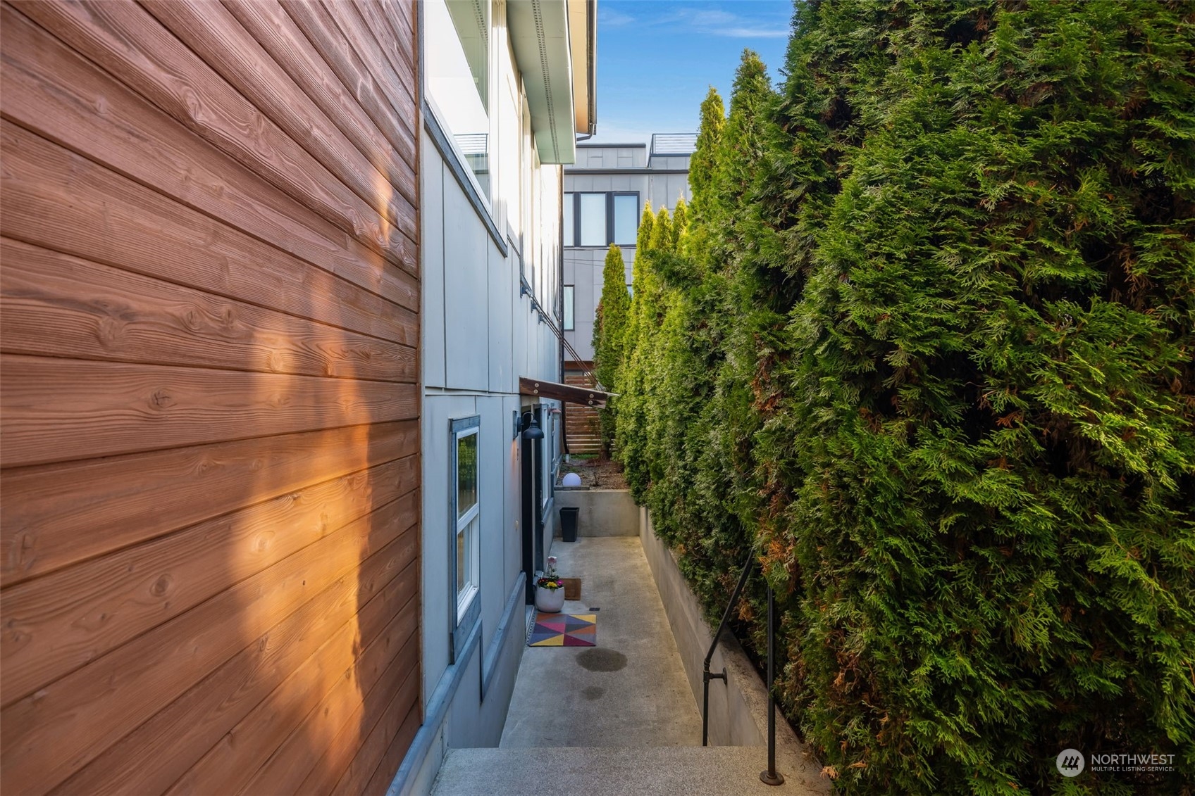 830 Northwest 53rd Street, Unit B Seattle, WA 98107 - Photo 4 of 28 a view of a pathway both side of house