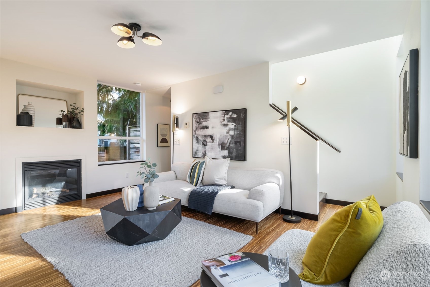 830 Northwest 53rd Street, Unit B Seattle, WA 98107 - Photo 6 of 28 a living room with furniture and a fireplace