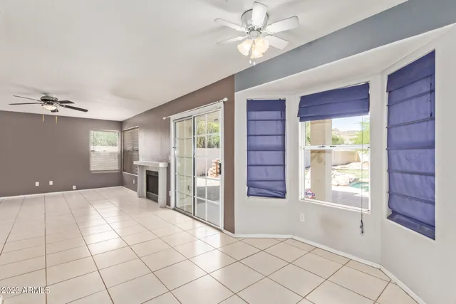 a kitchen with a refrigerator and a stove top oven