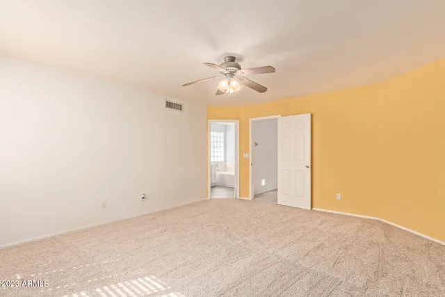 a bathroom with a double vanity sink a mirror and a bathtub