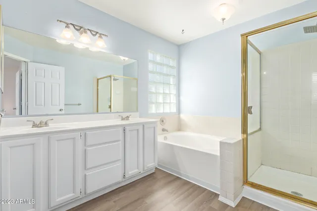 a bathroom with a bathtub and a shower