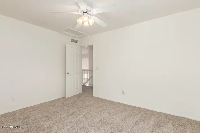 a bathroom with a bathtub shower sink vanity mirror and toilet