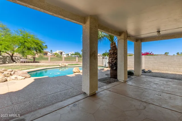a view of backyard of house with green space