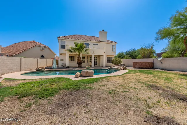 a view of a swimming pool with a patio