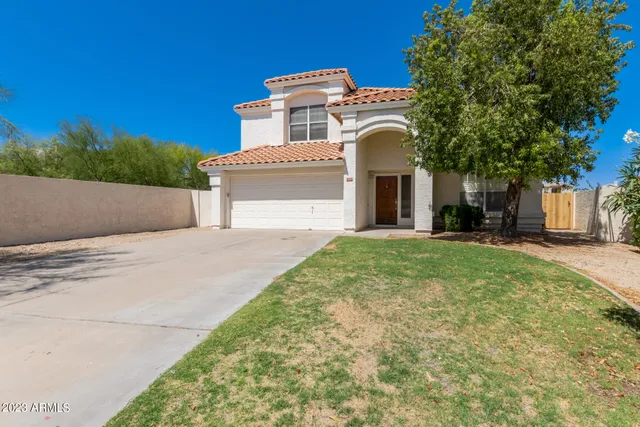 a view of a house with a small yard